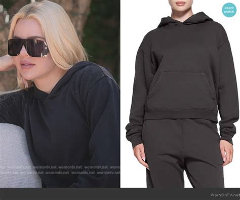 Khloe’s black shield sunglasses and hoodie on The .